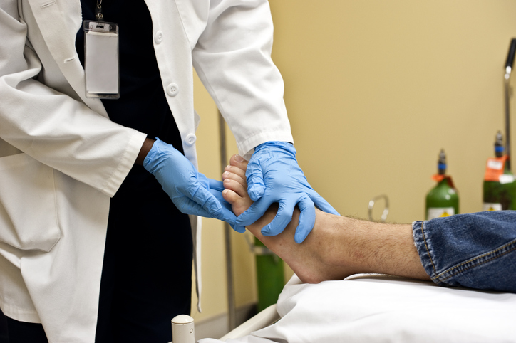 Checking the patient's foot